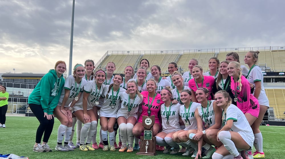 The Badin High School girls soccer team poses with the runner-up trophy after the Division III state championship game on Saturday, Nov. 8 at Historic Crew Stadium in Columbus. The Rams lost to Bay Village Bay 1-0. CHRIS VOGT / CONTRIBUTED PHOTO