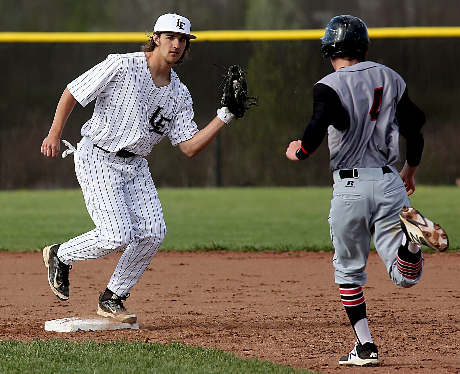 Lakota East shortstop Jefferson Szydlowski gets the force out on Oak Hills runner Corey Miley during their game in Liberty Township on Tuesday. CONTRIBUTED PHOTO BY E.L. HUBBARD