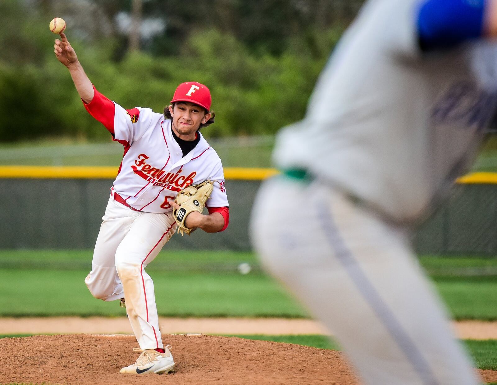 Fenwick’s Jared Kauffman throws a pitch en route to earning a save during Monday’s game against visiting Chaminade Julienne. NICK GRAHAM/STAFF