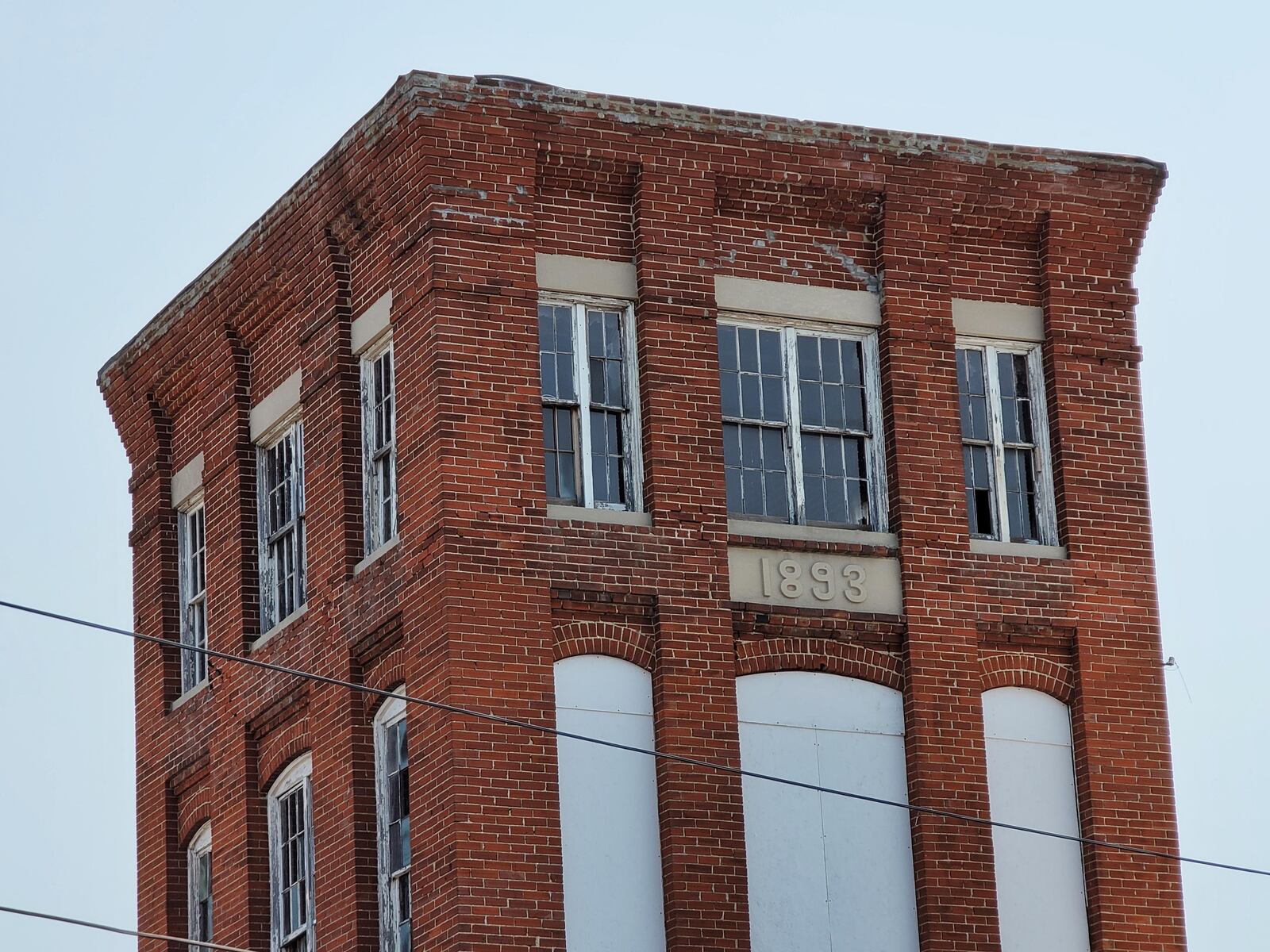 Hamilton has entered a development agreement for a 100-apartment complex plus retail space at the Shuler & Benninghofen Woolen Mill in Lindenwald. NICK GRAHAM/STAFF