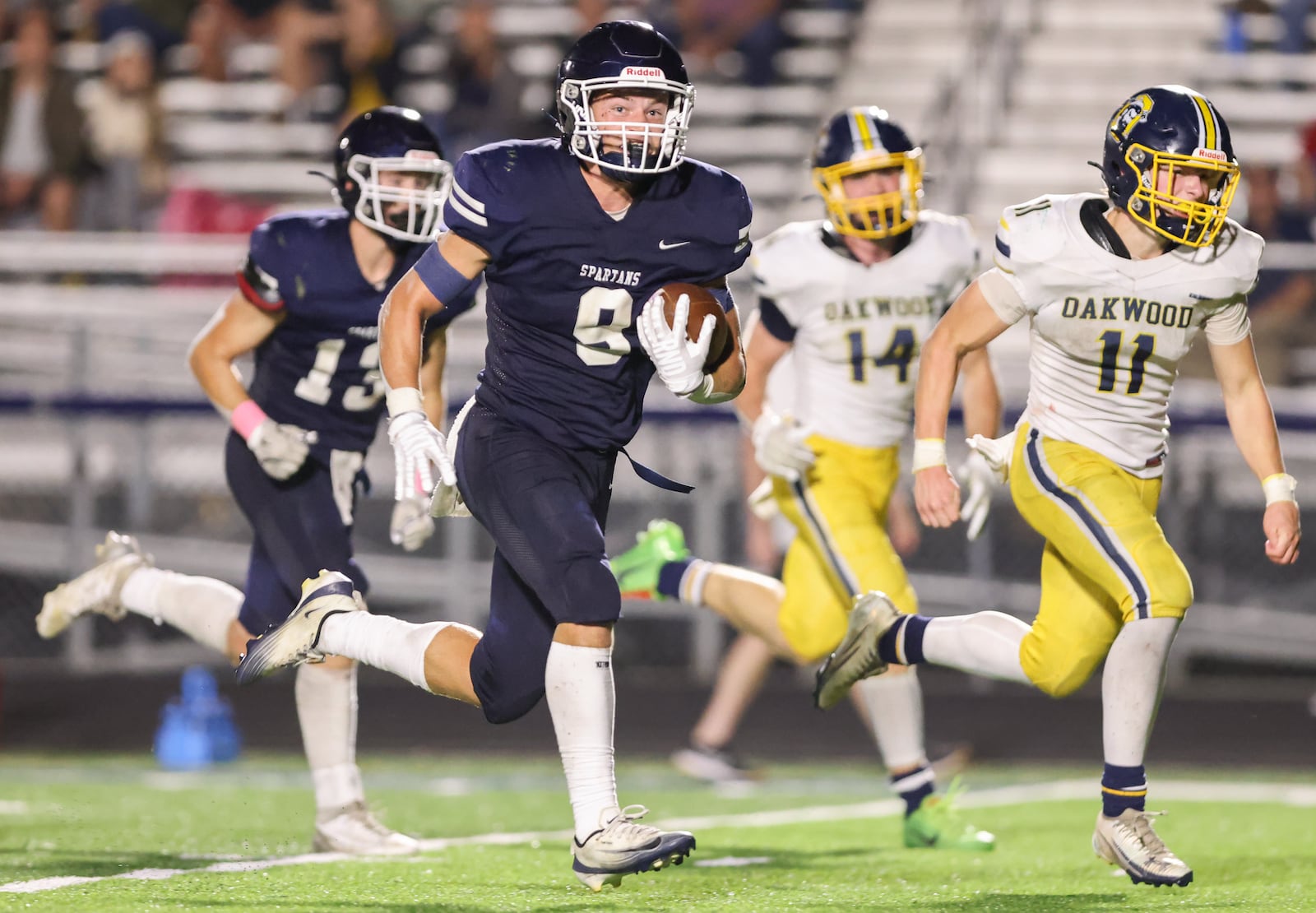 Oakwood senior Anthony Valenti runs during a 40-yard touchdown run early in the fourth quarter of a Southwestern Buckeye League game against Oakwood on Friday, Sept. 20 at Niswonger Field in Germantown. It was the decisive touchdown in a 20-19 victory. BRYANT BILLING / STAFF