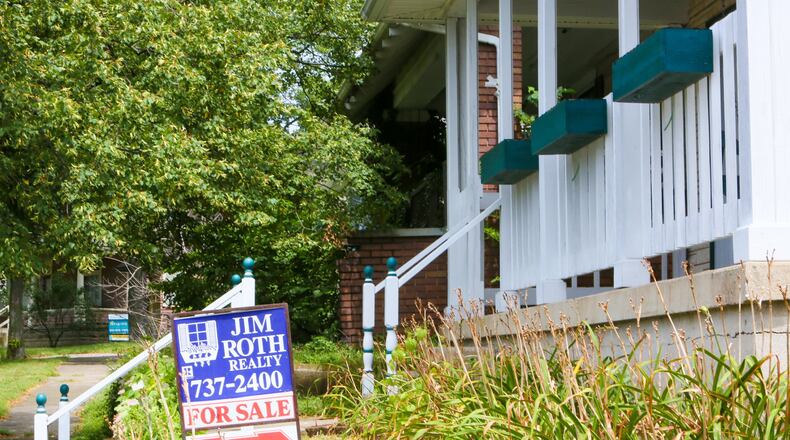 Two homes for sale along D Street in Hamilton, Monday, Aug. 7, 2017. Home sales, for Butler County and the region are continuing to hold steady through the first half of the year. Butler County saw 2,490 sales in 2017, compared to 2,489 in the first half of 2017. GREG LYNCH / STAFF
