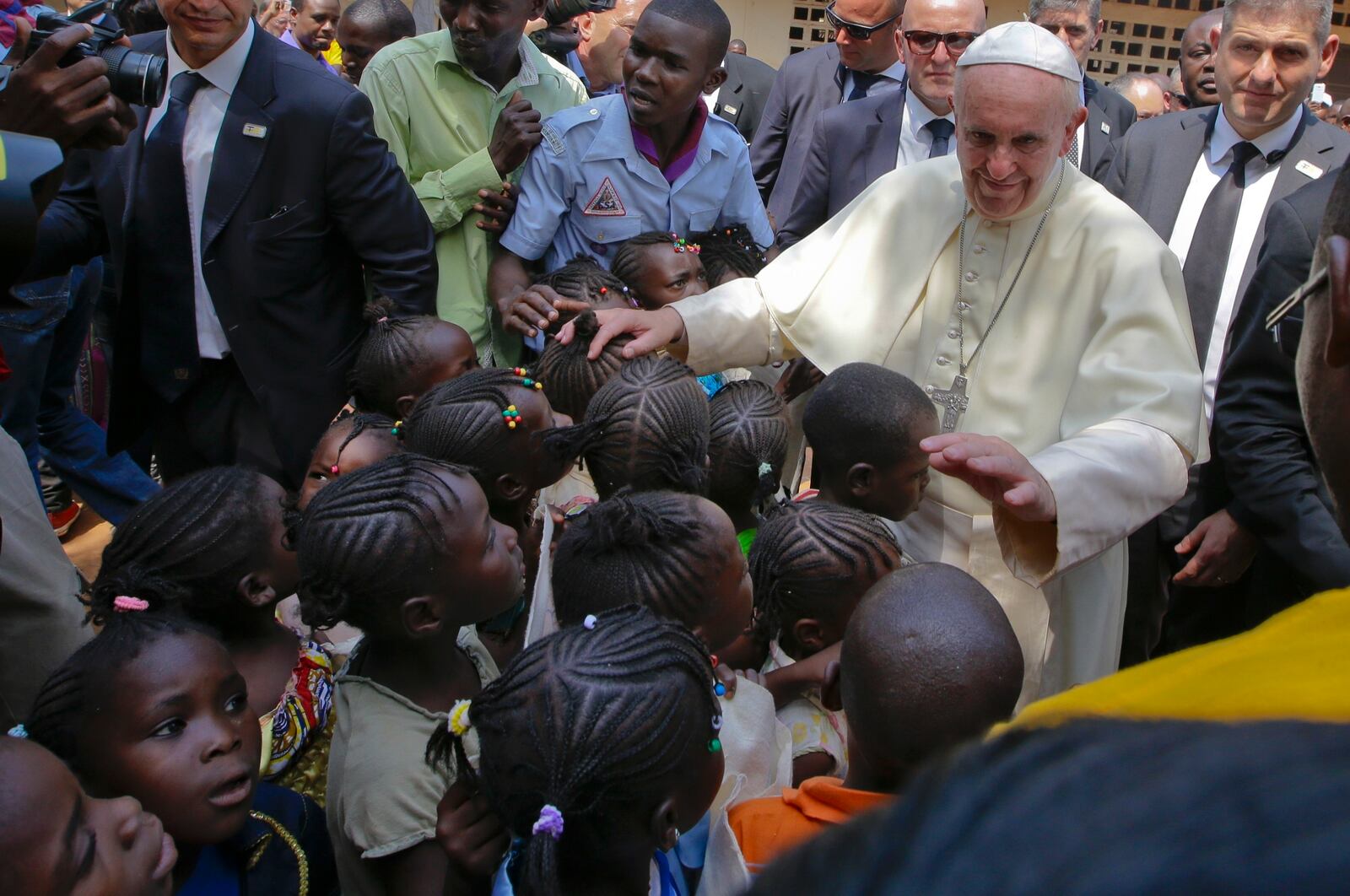 FILE - Pope Francis blesses children during his visit to people living at a refugee camp in Bangui, Central African Republic, Nov. 29, 2015. (AP Photo/Andrew Medichini, File)