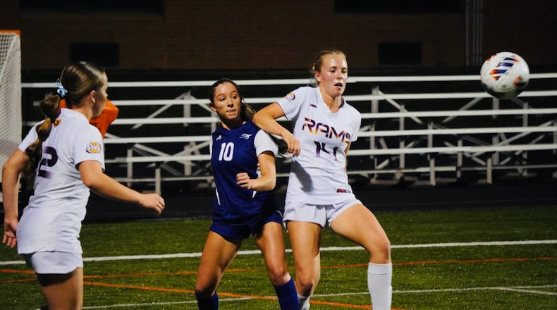 Ross sophomore Sarah Johnston (14) battles for position against Vandalia Butler's Carmella Decker (10) on Tuesday night in a Division III regional semifinal at Beavercreek. Chris Vogt/CONTRIBUTED