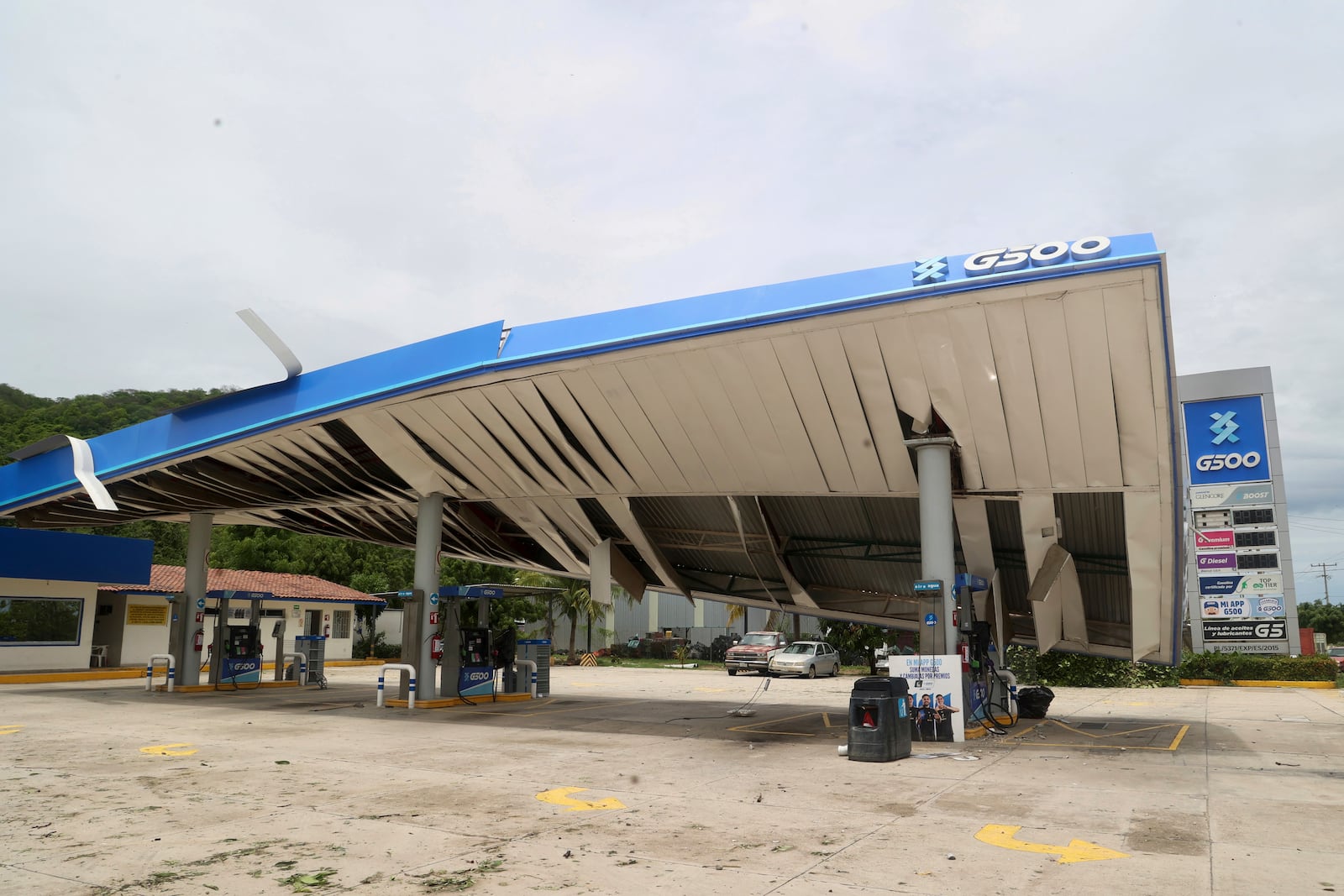 A gas station is damaged after Hurricane Erick hit near San Jose del Progreso, Oaxaca state, Mexico, Thursday, June 19, 2025. (AP Photo/Luis Alberto Cruz)