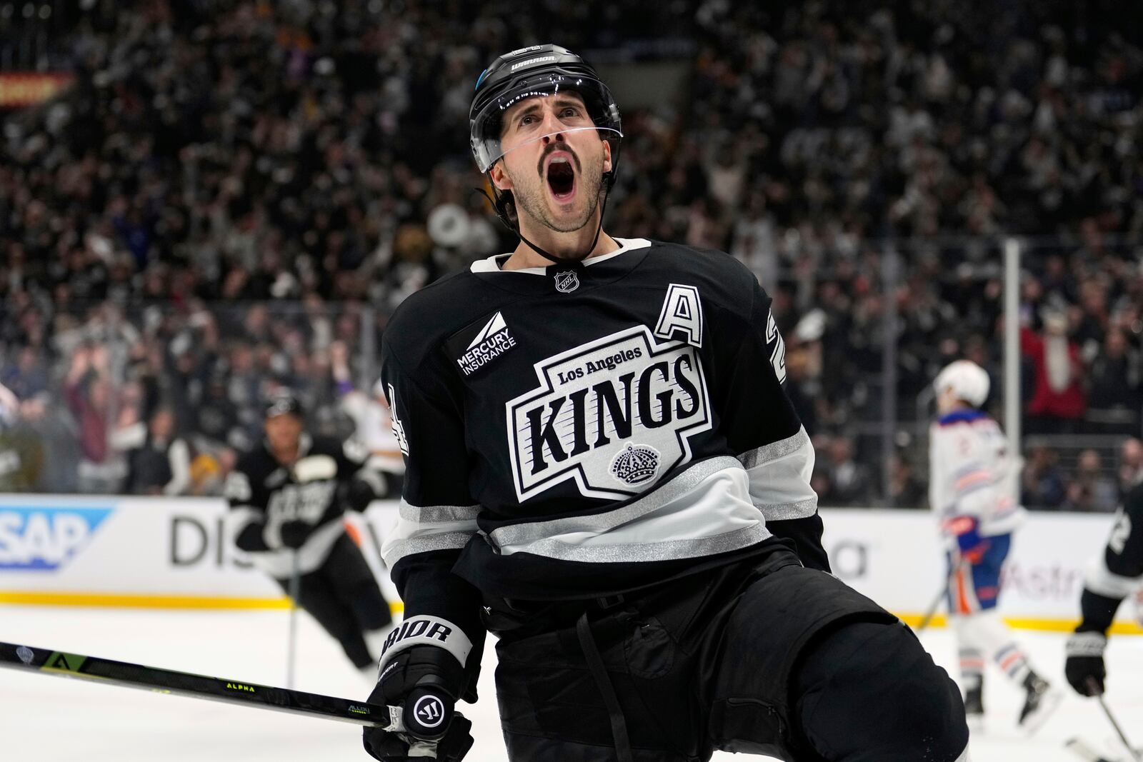Los Angeles Kings center Phillip Danault celebrates his goal during the second period in Game 1 of an NHL hockey first-round playoff series against the Edmonton Oilers, Monday, April 21, 2025, in Los Angeles. (AP Photo/Mark J. Terrill)