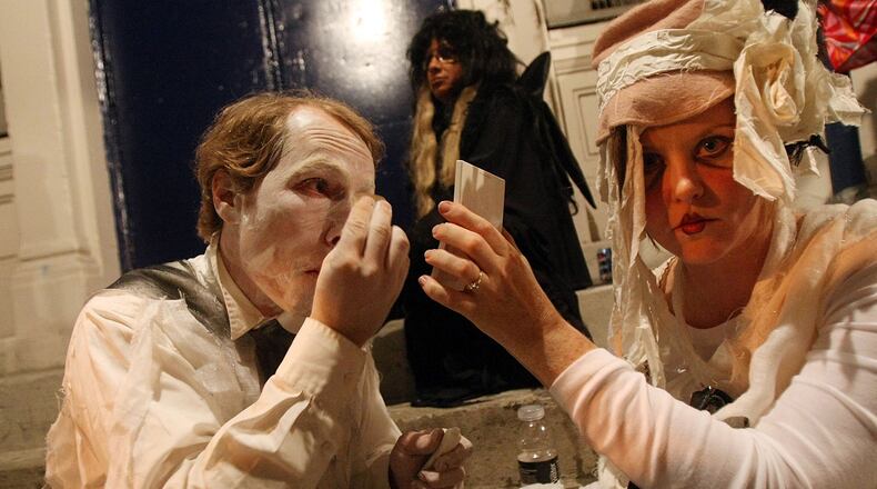 Participants apply makeup before marching in the annual Village Halloween Parade October 31, 2007 in New York City. Approximately 2 million visitors attend the event each year, making it the largest Halloween celebration in the country. (Photo by Mario Tama/Getty Images)