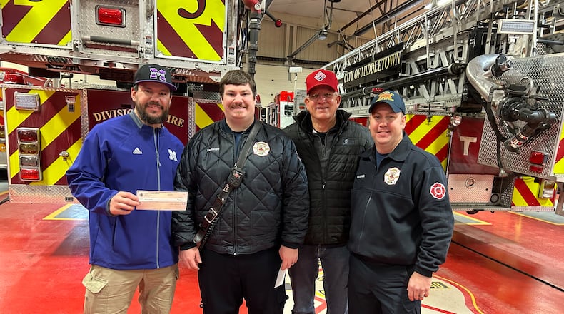 Middletown firefighters donated close to $10,000 Thursday afternoon to Middie Way Baseball, a youth program in the city. The money was generated by the annual firefighters golf outing at Wildwood Golf Club. From left, Kyle Schwarber, Lt. Mike Jones, Greg Schwarber and firefighter/paramedic Adam Stitsinger. RICK McCRABB/STAFF