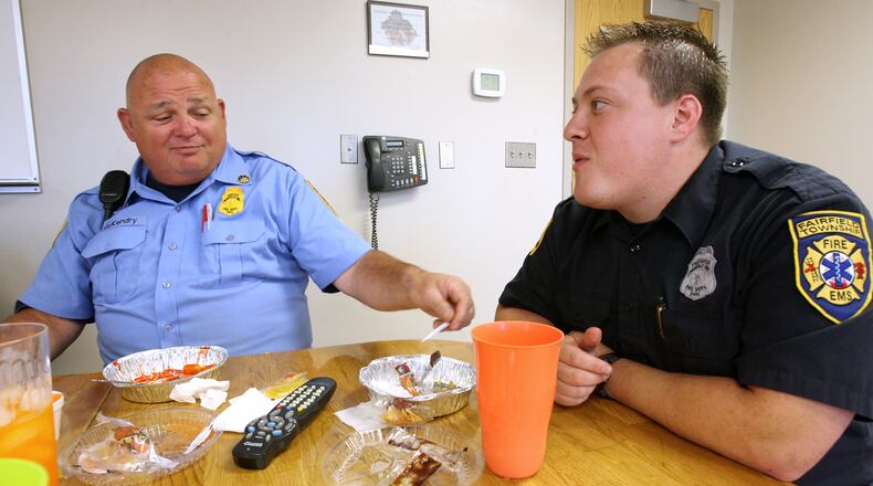 Fairfield Twp. trustees voted 2-1 against a petition by residents seeking to re-name the park at Millikin and Morris roads after the former township assistant fire chief Paul McKendry, who died in February 2009. McKendry, at left, is pictured eating lunch with firefighter Jody Asher in September 2007 at the Fairfield Twp. Fire Headquarters. FILE PHOTO/2007
