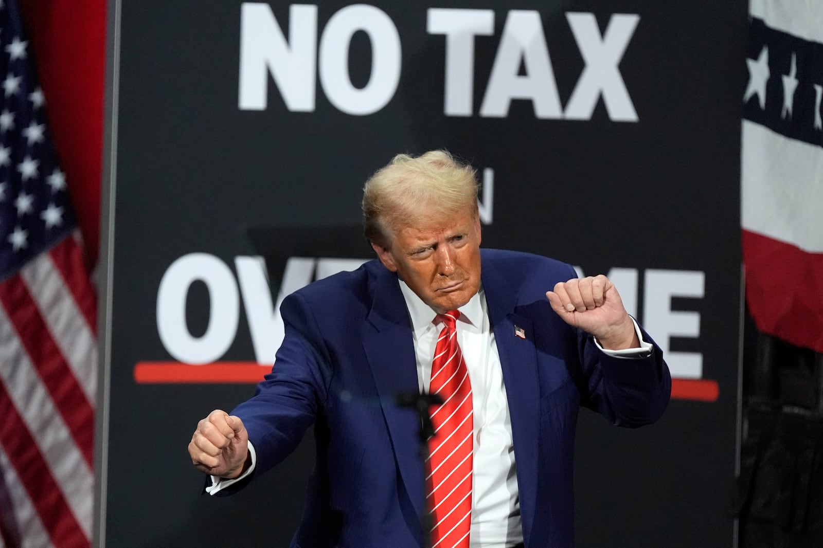 FILE - Republican presidential nominee former President Donald Trump dances at a campaign event at the Cobb Energy Performing Arts Centre, Oct. 15, 2024, in Atlanta. (AP Photo/John Bazemore, File)