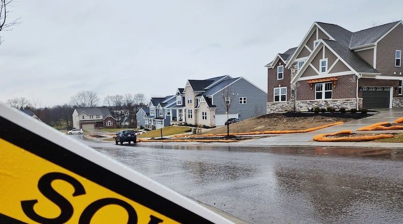 Home prices in Butler and Warren counties remained steady despite there being significantly fewer listings and significantly fewer sales at the end of 2022. Seen here are homes in a West Chester neighborhood. NICK GRAHAM/STAFF