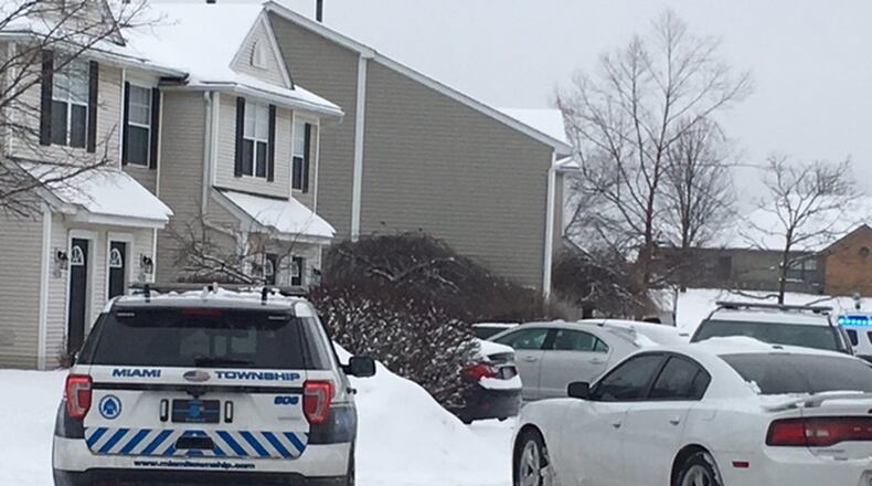 Miami Twp. police responded shortly before noon Friday to a call in which the initial reports indicated a man at the Preserve of Sagebrook apartments killed two people. NICK BLIZZARD/STAFF