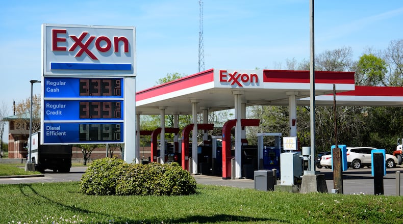 Prices are displayed on an Exxon gas station sign in Houston, Tuesday, March 17, 2026. (AP Photo/Ashley Landis)
