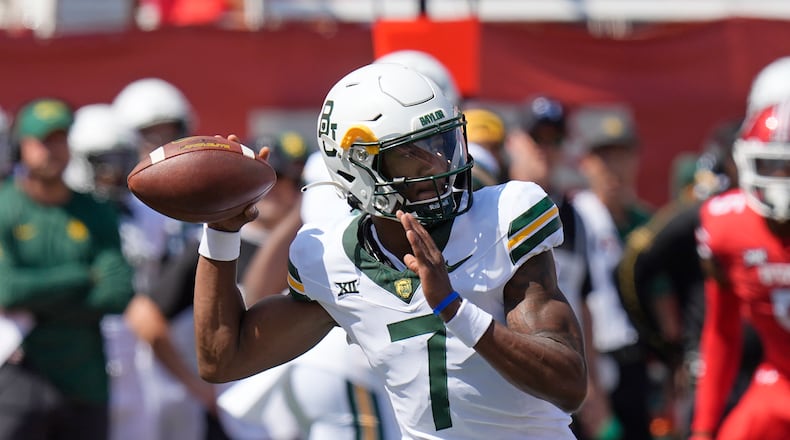 Baylor quarterback Dequan Finn (7) throws against Utah in the first half during an NCAA college football game Saturday, Sept. 7, 2024, in Salt Lake City. (AP Photo/Rick Bowmer)