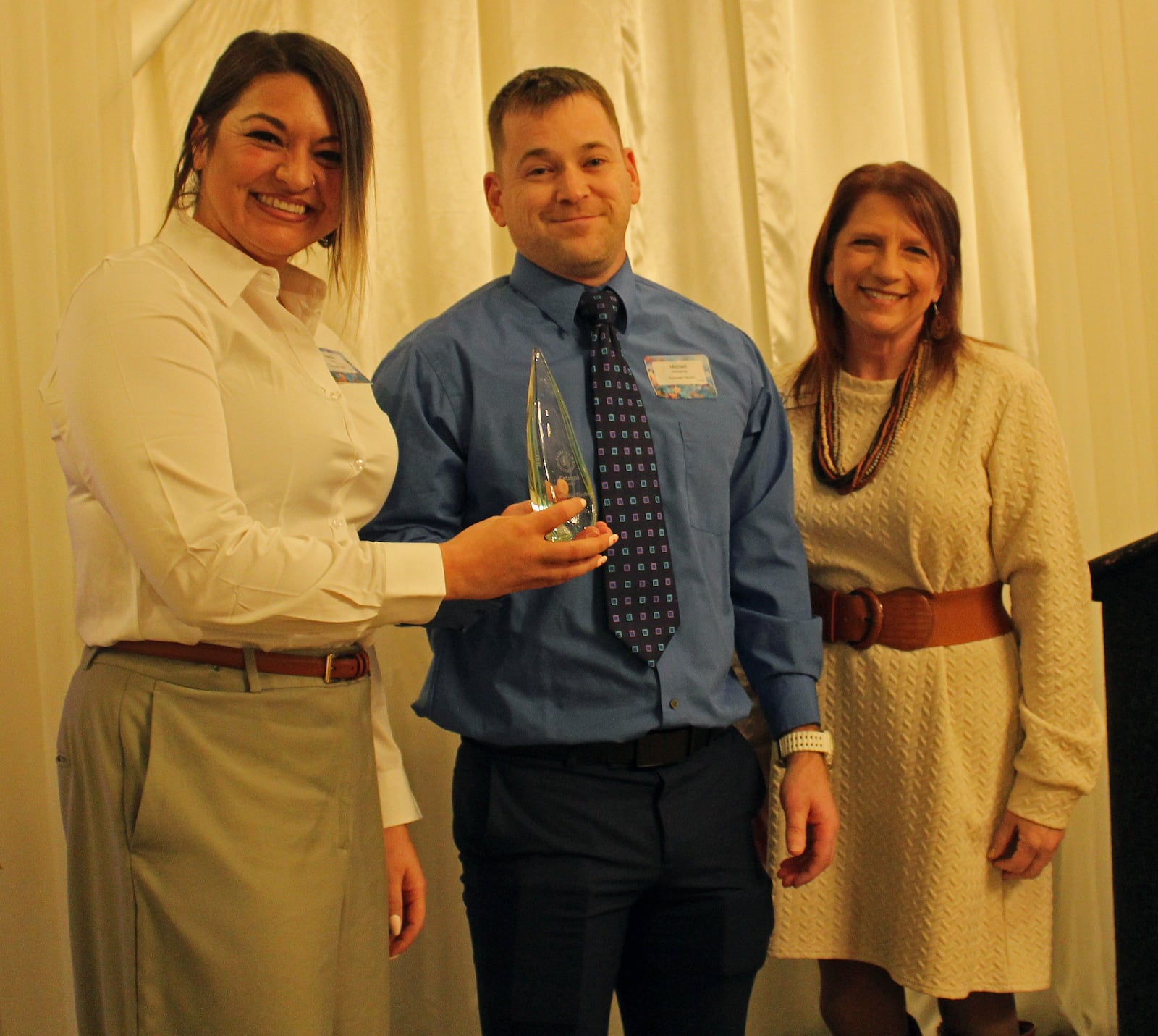Schneider Electric’s Vanessa Smith, left, and Michael Deerwester accept the Fairfield Chamber of Commerce’s Catalyst Award presented by Jamie Bella, outgoing chairwoman of the chamber’s board of directors. SUE KIESEWETTER/CONTRIBUTED