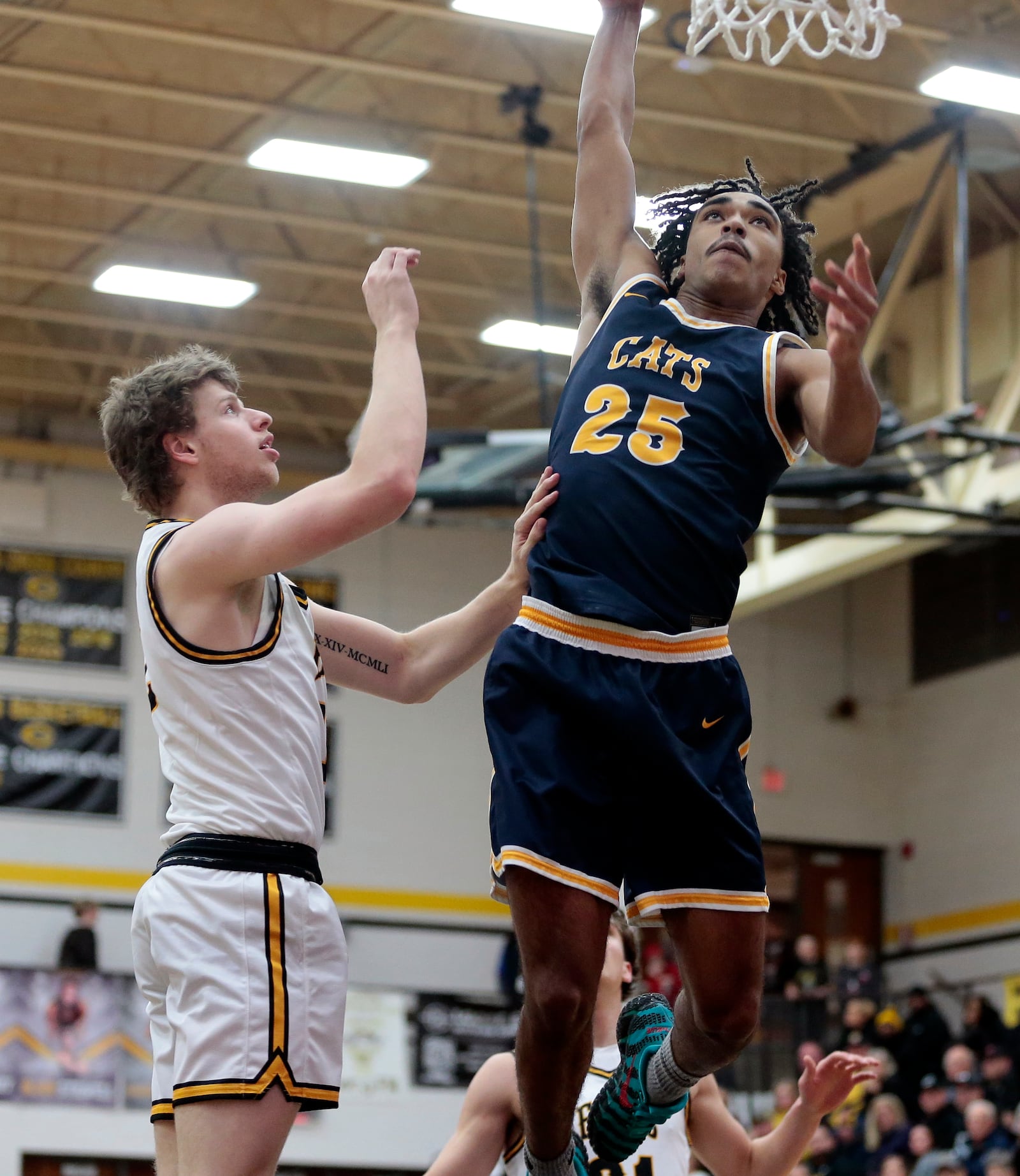 Springfield senior E. J. Rice (25) throws down a dunk during a game against Centerville on Friday, Dec. 12, 2025, in Centerville. STEVEN WRIGHT / STAFF