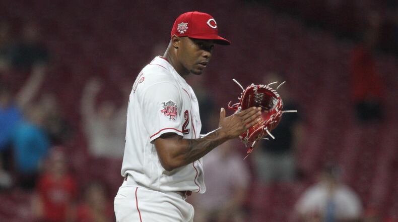 Reds reliever Raisel Iglesias claps after the final out of a victory against the Angels on Tuesday, Aug. 6, 2019, at Great American Ball Park in Cincinnati. David Jablonski/Staff
