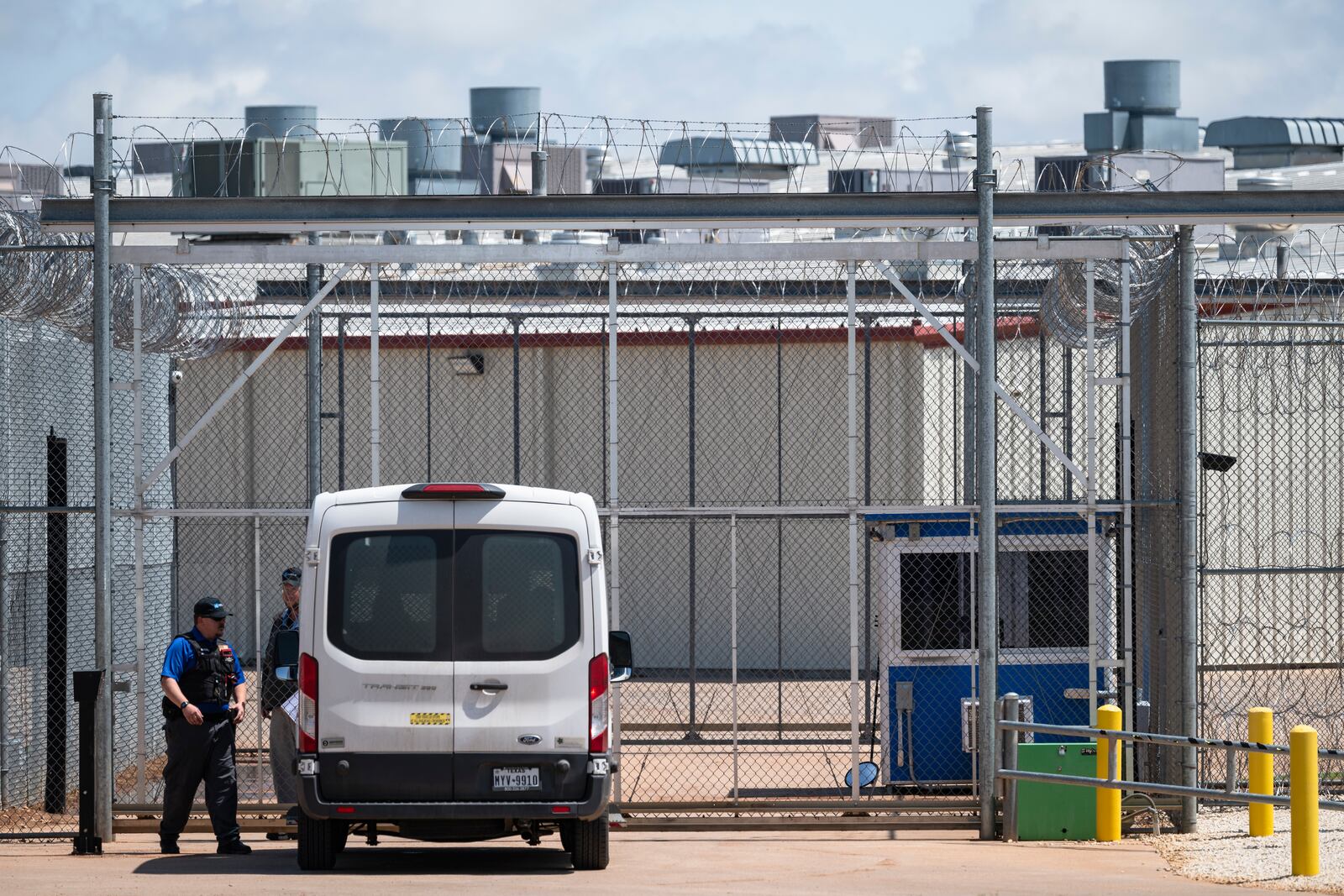 A passenger van carrying a detained person waits to enter the sally port at at Bluebonnet Detention Center Thursday, April 24, 2025, in Anson, Texas. (AP Photo/Eli Hartman)