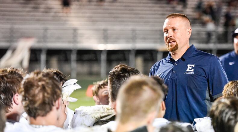 Edgewood coach Scott Clemmons talks with his team after the Cougars defeated Harrison during a game in 2018. NICK GRAHAM/STAFF