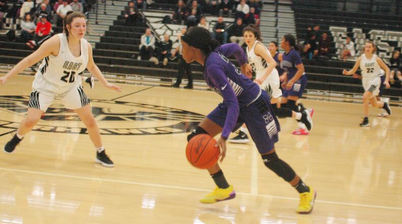 Middletown’s Addison Bess (35) heads up the floor as Lakota East’s Camryn Eddy (20) defends Wednesday night in Liberty Township. The host Thunderhawks won 48-43. RICK CASSANO/STAFF