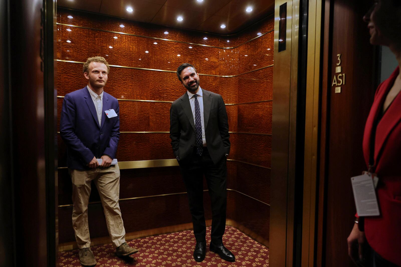 Zohran Mamdani, right, leaves the WNBC studio after participating in a Democratic mayoral primary debate, Wednesday, June 4, 2025, in New York. (AP Photo/Yuki Iwamura, Pool)