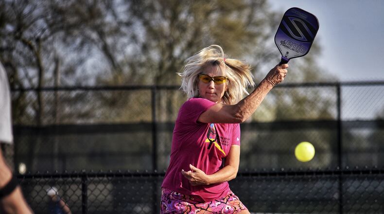 Molly Wray returns a volley as she plays pickleball earlier this year on the Middletown Pickleball Association courts at Lefferson Park. The association is hosting a tournament this weekend. NICK GRAHAM / STAFF