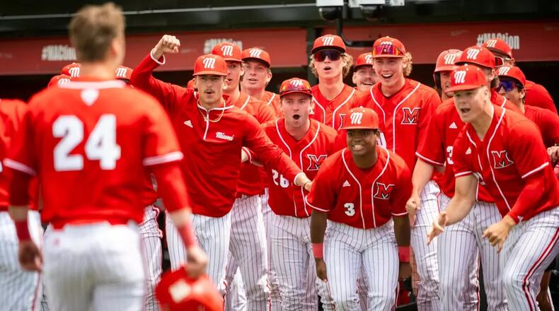 Miami's Ty Batusich (24) is greeted by teammates after hitting a home run during a recent game. MIAMI ATHLETICS / CONTRIBUTED