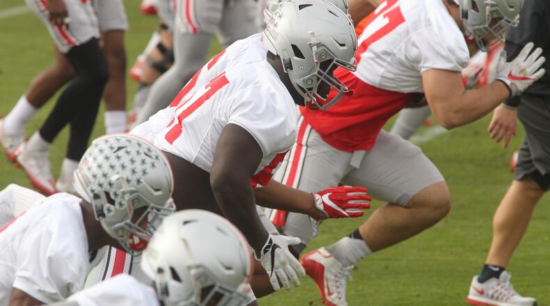 Ohio State’s Robert Landers, center, runs during a Fiesta Bowl practice at Notre Dame Prep Academy on Wednesday, Dec. 28, 2016, in Scottsdale, Ariz. David Jablonski/Staff