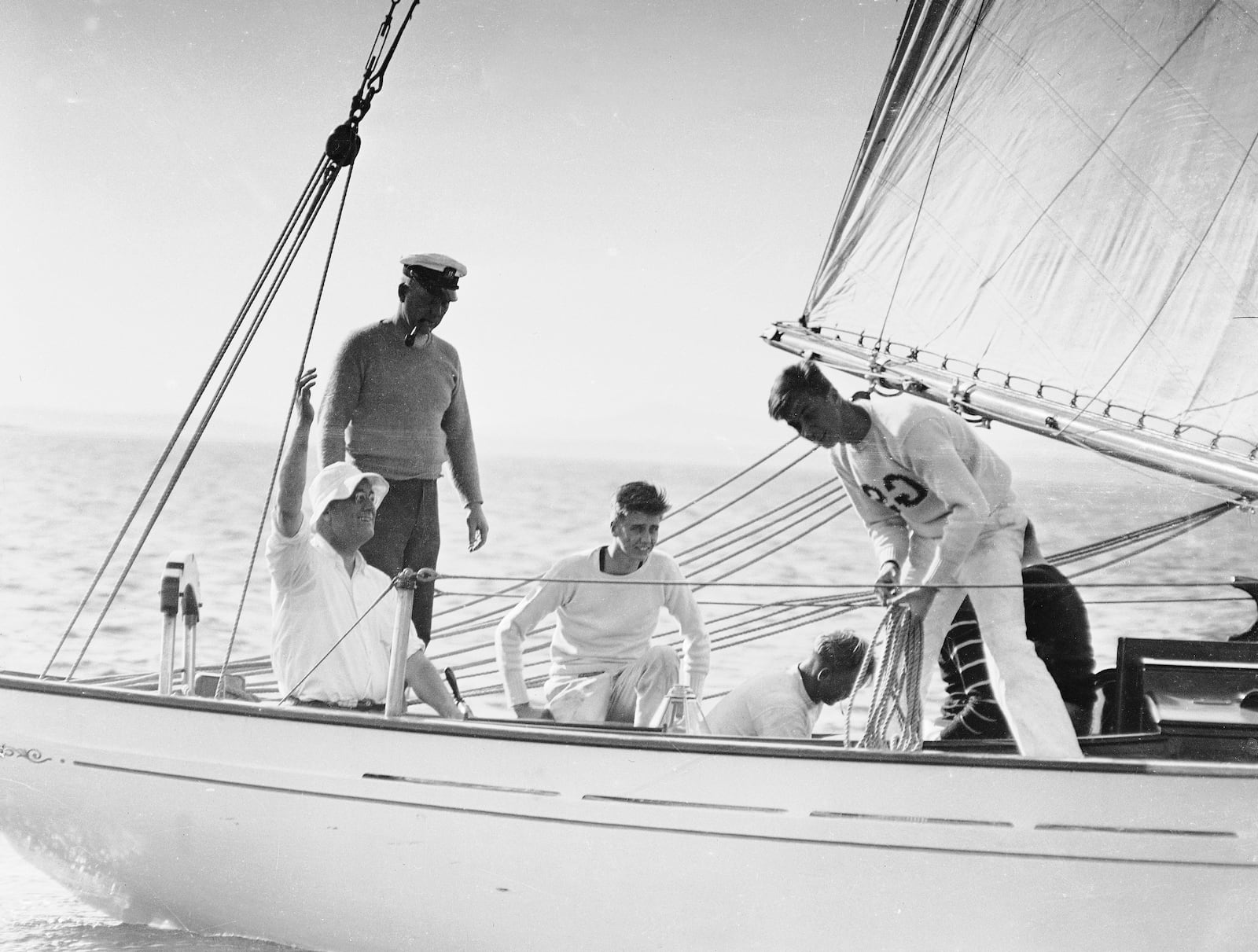 FILE - The 45-foot schooner Amberjack, with President Franklin D. Roosevelt aboard, seated and wearing sailor's hat, is shown sailing from Buzzard's Bay, Mass., toward Campobello Island, off the coast of Maine, during his vacation, June 1933. Crew members are unidentified. (AP Photo, File)
