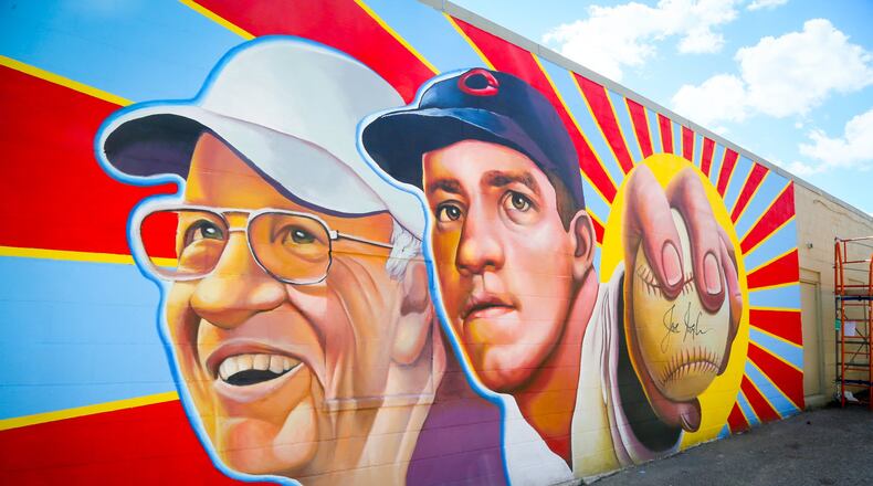 The StreetSpark program created this Hamilton mural featuring Cincinnati Reds legend, Joe Nuxhall, on the side of Clark’s Sporting Goods on Hamilton’s West Side. GREG LYNCH / STAFF