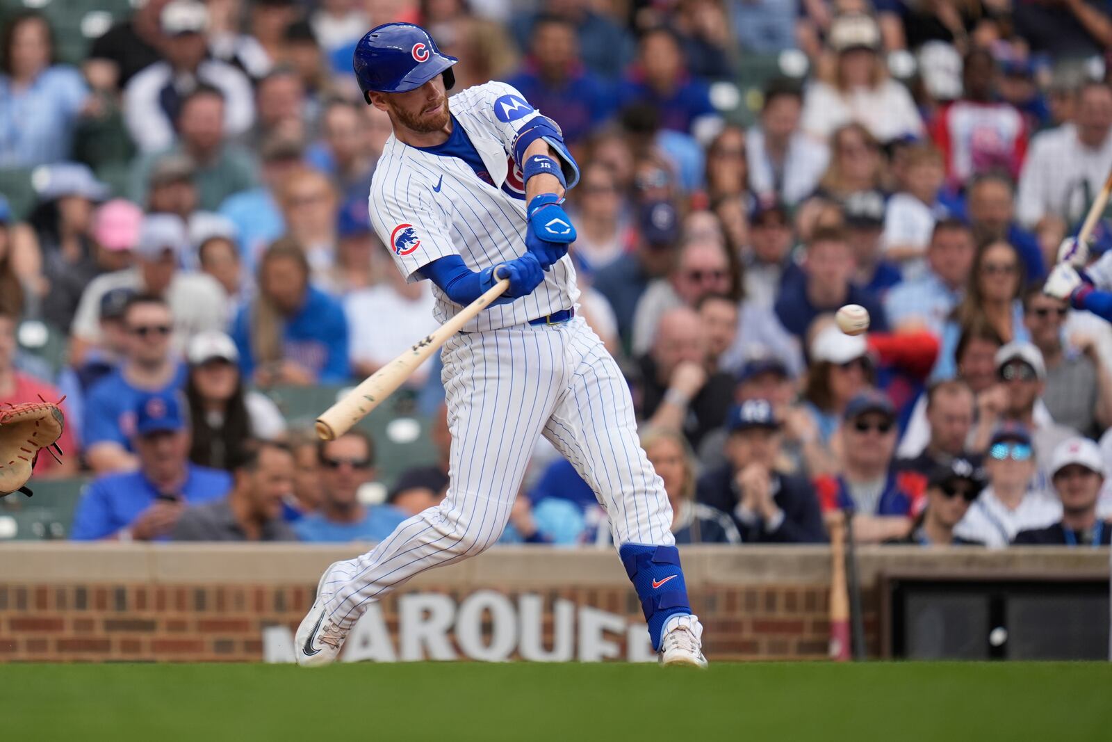 CORRECTS TO THREE-RUN HOME RUN NOT TWO-RUN HOME RUN - Chicago Cubs' Kyle Tucker hits a three-run home run during the eighth inning of a baseball game against the Arizona Diamondbacks, Friday, April 18, 2025, in Chicago. (AP Photo/Erin Hooley)