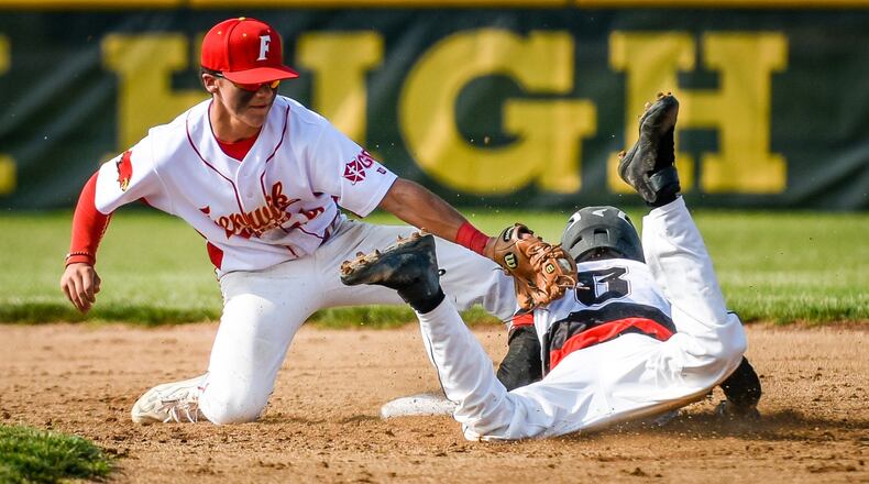Fenwick’s R.J. Clesceri just misses the tag on Franklin’s Austin Gilbert during the host Falcons’ 1-0 win in a Division II sectional game May 10, 2017. NICK GRAHAM/STAFF