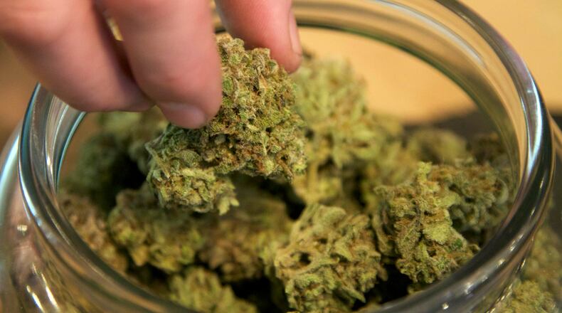Members of Middletown City Council are considering converting a temporary moratorium against medical-marijuana facilities into a ban that later can be lifted after Ohio officials issue rules governing such operations. CONTRIBUTED