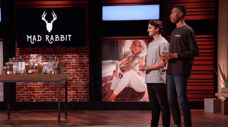Recent Miami University graduates Oliver Zak (left) and Selom Agbitor impressed in their high-pressure debut last Friday on ABC's nationally televised show "Shark Tank." The pair, which created the Mad Rabbit skin care company, got investor Mark Cuban to pony up $500,000 for their start up firm. The two are shown on stage during the broadcast. (Provided Photo\Journal-News)