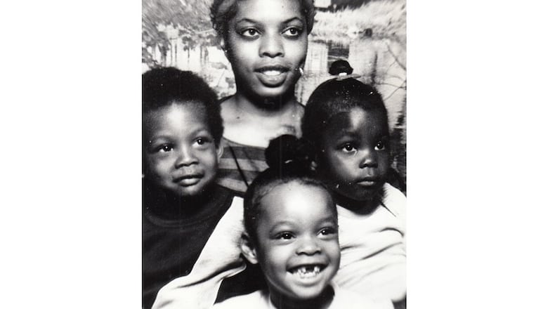 Lana Green with three of her children, Tia Green, 5; Voilana Green, 6, and Gregory Webster, 3. DAYTON DAILY NEWS ARCHIVE