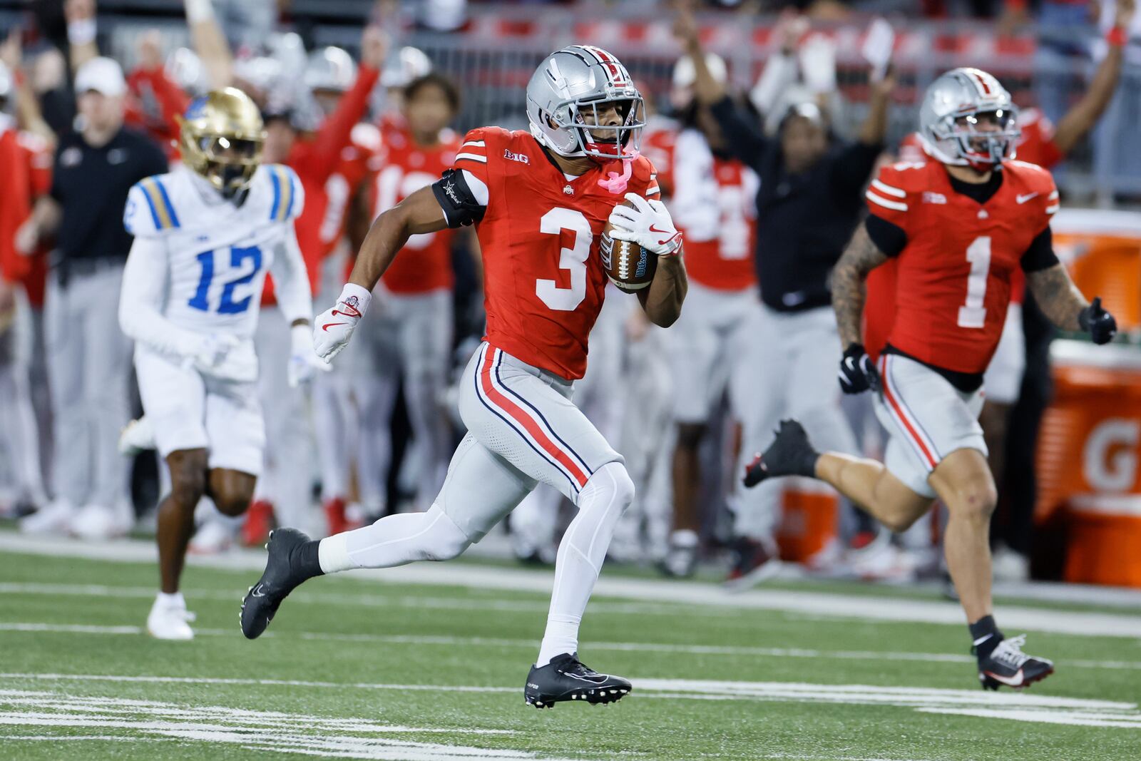 Ohio State defensive back Lorenzo Styles (3) runs back a kickoff for a touchdown against UCLA during the second half of an NCAA college football game, Saturday, Nov. 15, 2025, in Columbus, Ohio. (AP Photo/Jay LaPrete)