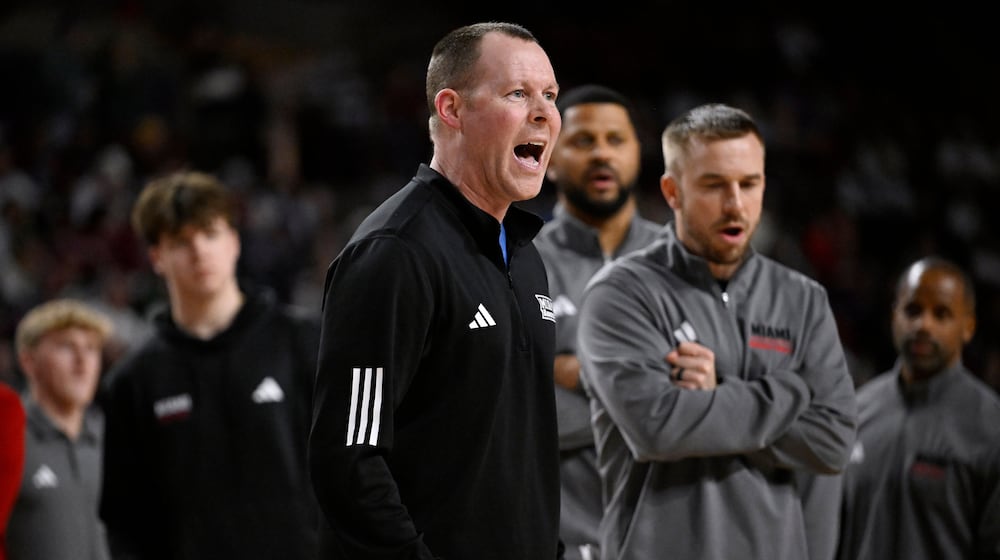 Miami Ohio head coach Travis Steele calls out to officials in the second half of an NCAA college basketball game against UMass, Tuesday, Feb. 17, 2026, in Amherst, Mass. (AP Photo/Jessica Hill)