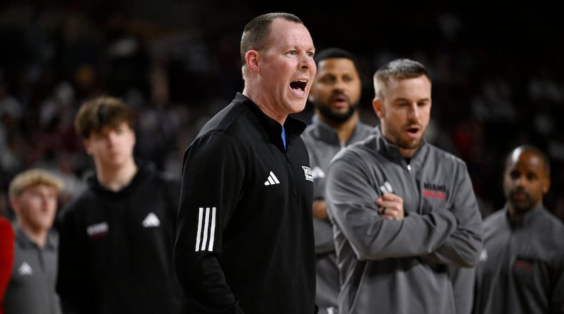 Miami Ohio head coach Travis Steele calls out to officials in the second half of an NCAA college basketball game against UMass, Tuesday, Feb. 17, 2026, in Amherst, Mass. (AP Photo/Jessica Hill)