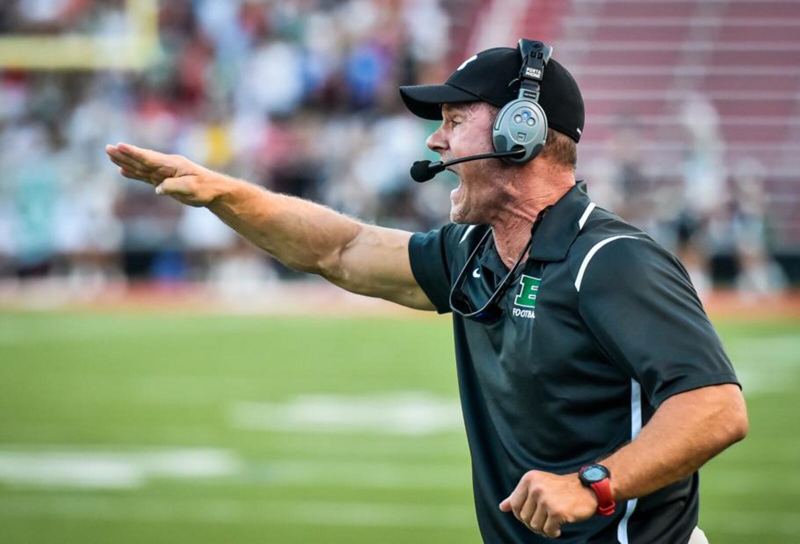 Badin defensive coordinator Joe Schlager calls out instructions during Friday night’s game against Roger Bacon at Fairfield Stadium. NICK GRAHAM/STAFF