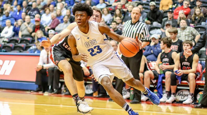 Cincinnati Christian’s Cameron Rogers (23) has his eyes on the basket during a drive in Friday night’s Division IV district basketball final against Fort Loramie at the University of Dayton Arena. Fort Loramie won 49-41. CONTRIBUTED PHOTO BY MICHAEL COOPER