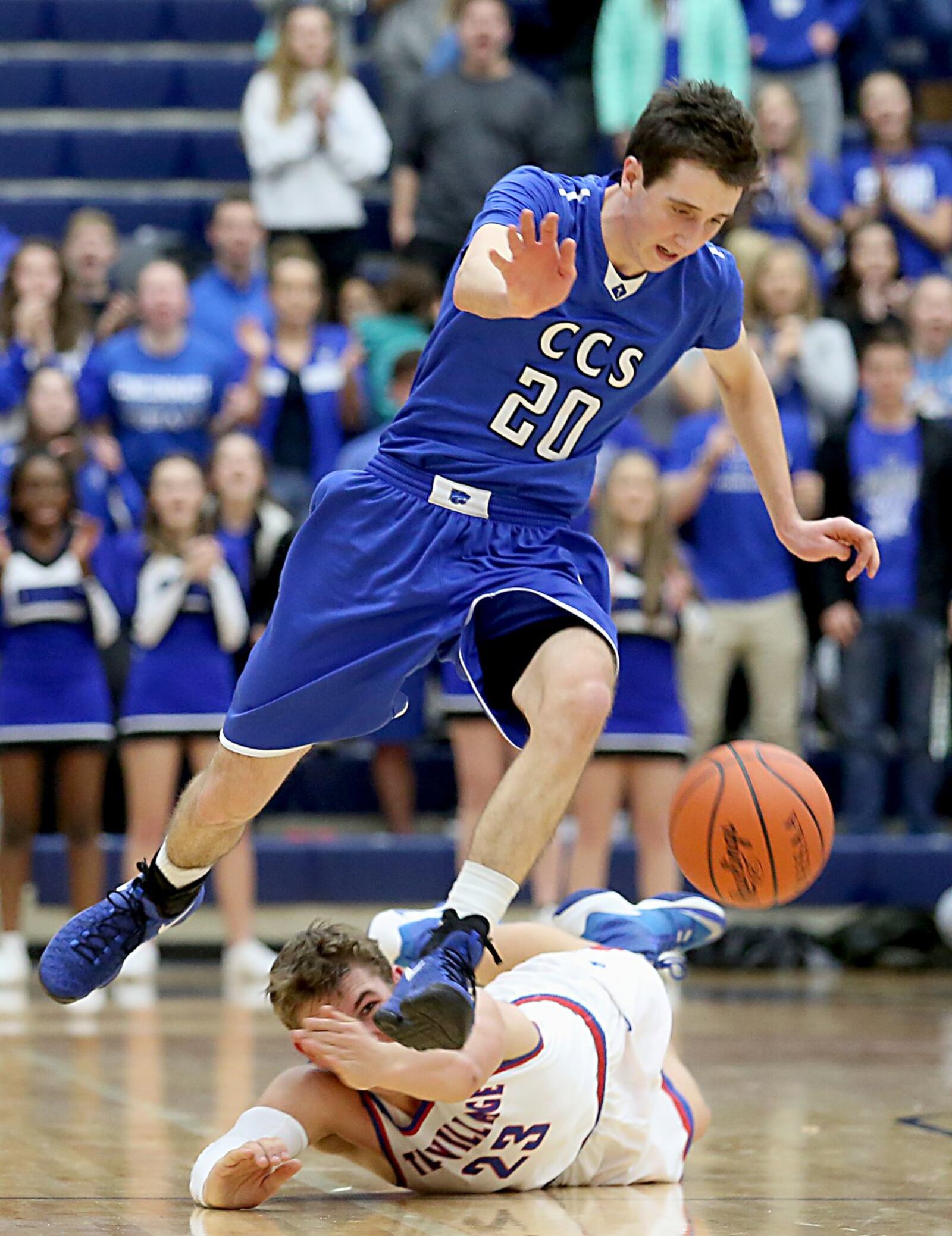Cincinnati Christian’s Brady Roberts continues upcourt despite the defense of Tri-Village’s Jared Buckley during their Division IV regional semifinal at Fairmont’s Trent Arena on Tuesday night. CONTRIBUTED PHOTO BY E.L. HUBBARD