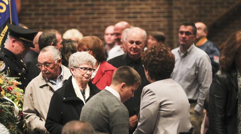 A crowd stands in line at Towne Boulevard First Church of God in Middletown on Friday, Nov. 15, for the visitation service of retired Officer Mike Davis, former director of the Middletown’s Safety Town program and a school resource officer for 26 of his 44-year career with the Middletown Division of Police. Davis died Wednesday at Atrium Medical Center. He was 65. GREG LYNCH / STAFF
