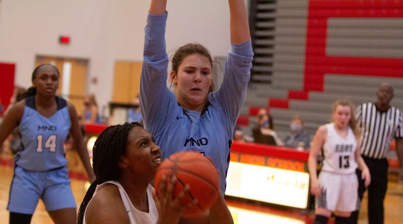 Lakota East senior Bri Harris tries to score inside against Mount Notre Dame in Saturday's Division I district final at Princeton High School. East's season came to an end in a 56-22 loss. Jeff Gilbert/CONTRIBUTED