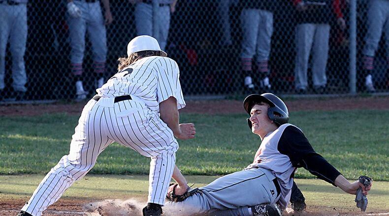 Lakota East’s Jefferson Szydlowski tags out Oak Hills’ Drew Wetterich at home plate to end the game Tuesday at East. CONTRIBUTED PHOTO BY E.L. HUBBARD