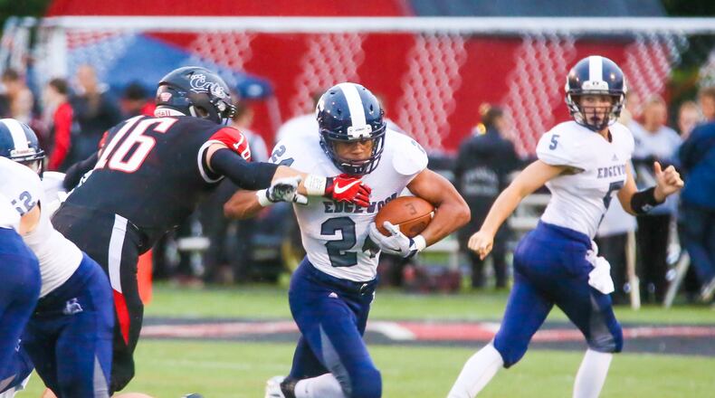 Edgewood fullback Elijah Williams (24) tries to break a tackle during a game against Franklin at Atrium Stadium in Franklin on Sept. 21. The host Wildcats won 49-21. GREG LYNCH/STAFF