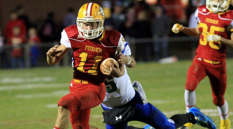 Fenwick running back Warren Kusneske picks up a first down before Chaminade Julienne defensive back Jacob Harrison pulls him down late in the second quarter during their game at Fenwick’s Krusling Field on Oct. 24, 2014. CONTRIBUTED PHOTO BY E.L. HUBBARD
