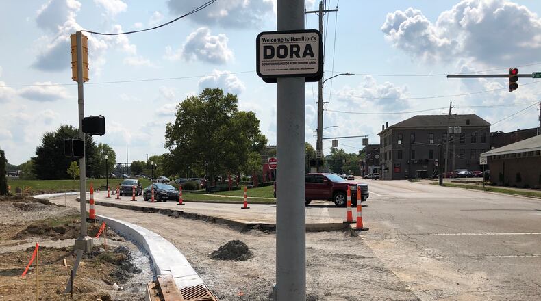 A new dedicated right-turn lane is being added that will ease traffic congestion for westbound vehicles on Hamilton's High-Main bridge onto North B Street and the future Spooky Nook Sports Champion Mill indoor sports complex. MIKE RUTLEDGE/STAFF