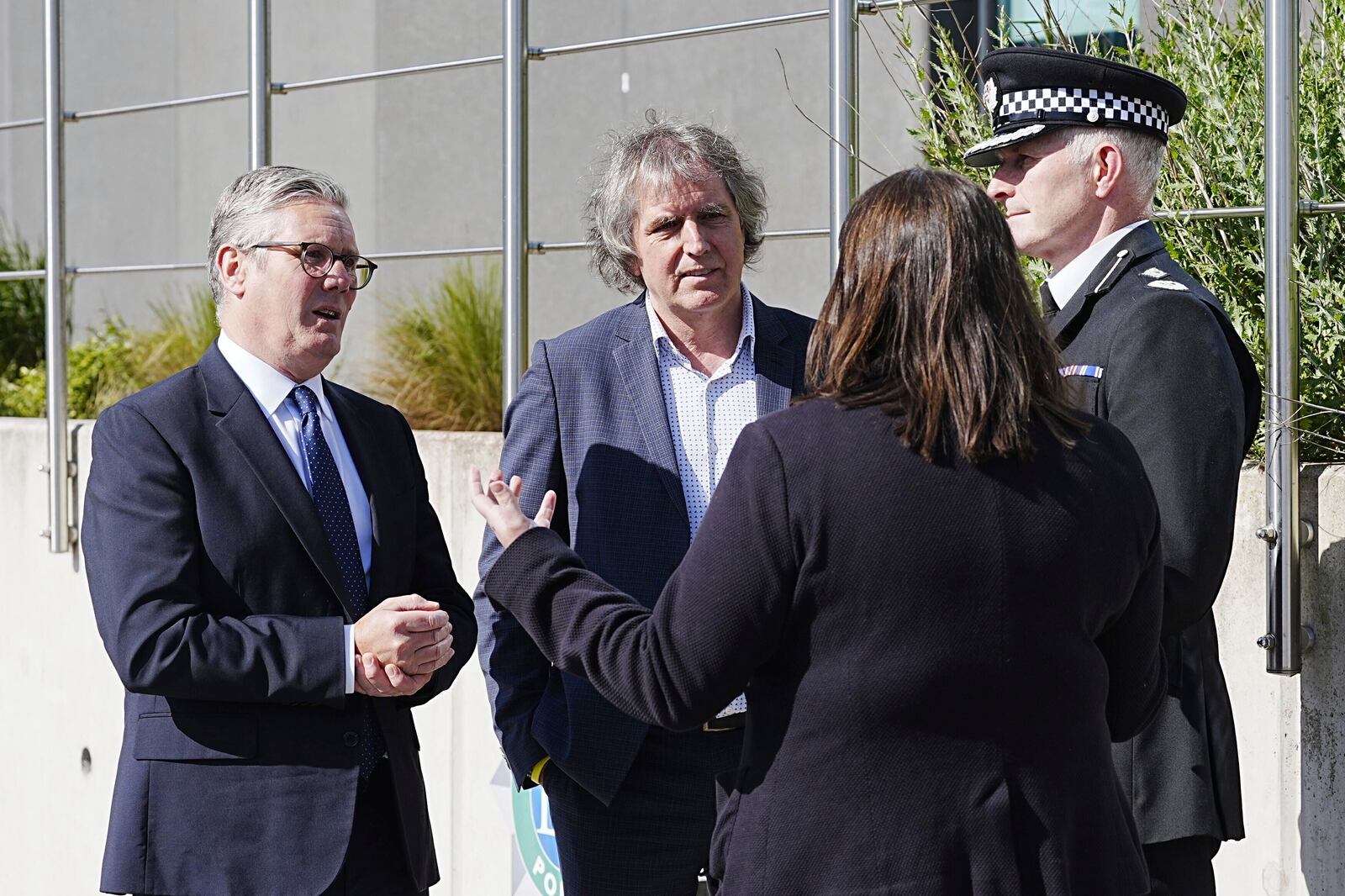 Britain's Prime Minister Keir Starmer, left, meets with Police and Crime Commissioner Emily Spurrell, second right, Deputy Chief Constable Chris Green, right, and the Mayor of Liverpool City Region, Steve Rotheram at Merseyside Police Headquarters, in Liverpool, England, Wednesday, May 28, 2025. (Peter Byrne/Pool photo via AP)