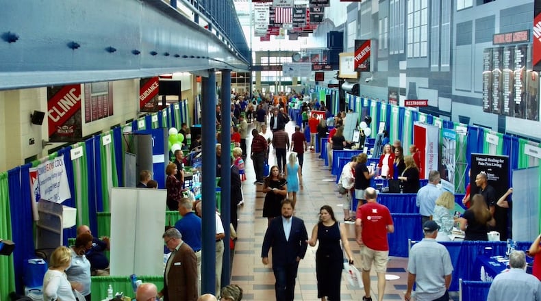 Hundreds filed through Lakota West High School's giant main hallway Tuesday to see area business exhibits at the West Chester\Liberty Chamber Alliance's first expo since 2019. The 2020 expo was cancelled due to precautions brought on by the coronavirus pandemic. (Provided Photo\Journal-News)