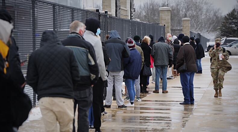 People wait in line at the Montgomery County Fairgrounds for free coronavirus testing on Tuesday, Dec. 1, 2020. STAFF/MARSHALL GORBY